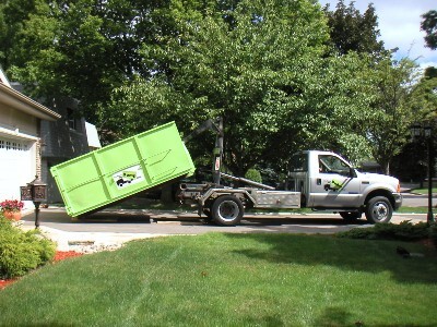 Dumpster Rental and A Truck on A Driveway